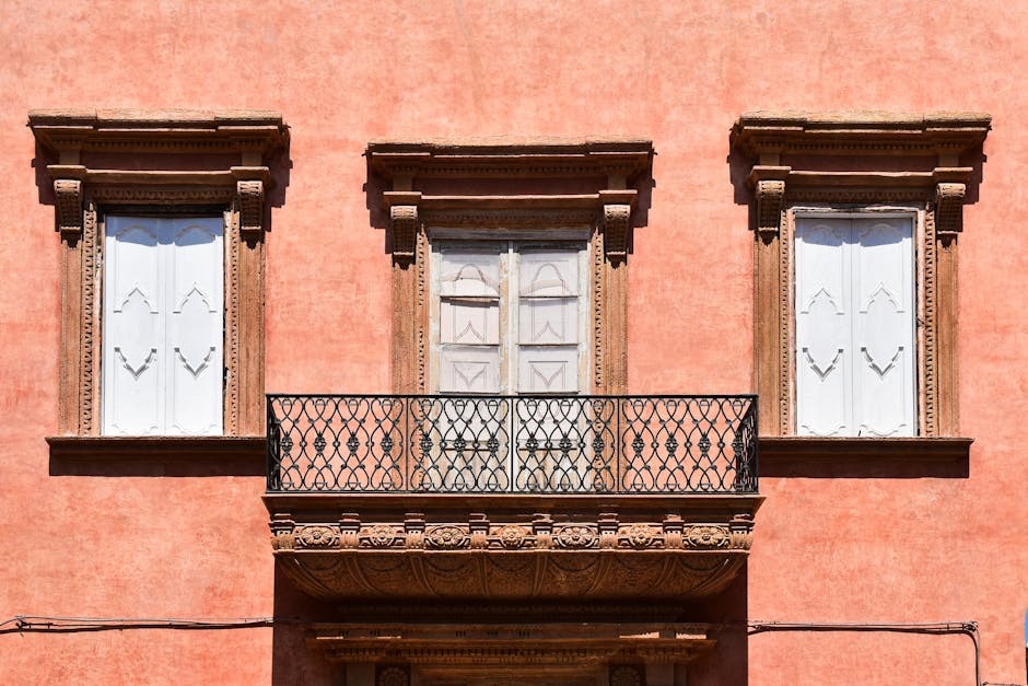 Baroque balcony detailed ironwork Lecce narrow street