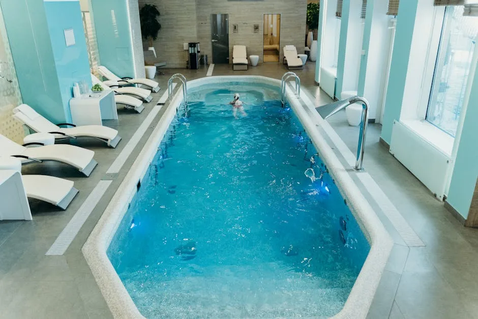 Indoor spa pool with lounge chairs in a Lecce hotel