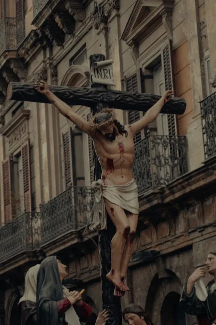 Wooden crucifix statue carried during procession in Lecce's historic street