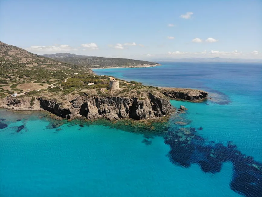 Old coastal tower on a cape with turquoise waters, Salento