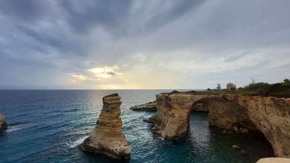 Torre Sant'Andrea rock arch at sunset